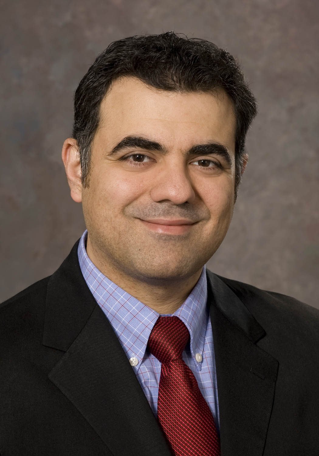 Headshot of Amir Zeki